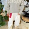 Crew Neck Sweater with Patch – Sweaters and Cardigans Crew Neck Sweater with Patch – Sweaters and Cardigans